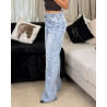 Jean taille haute coupe ample, en denim délavé avec trou effiloché